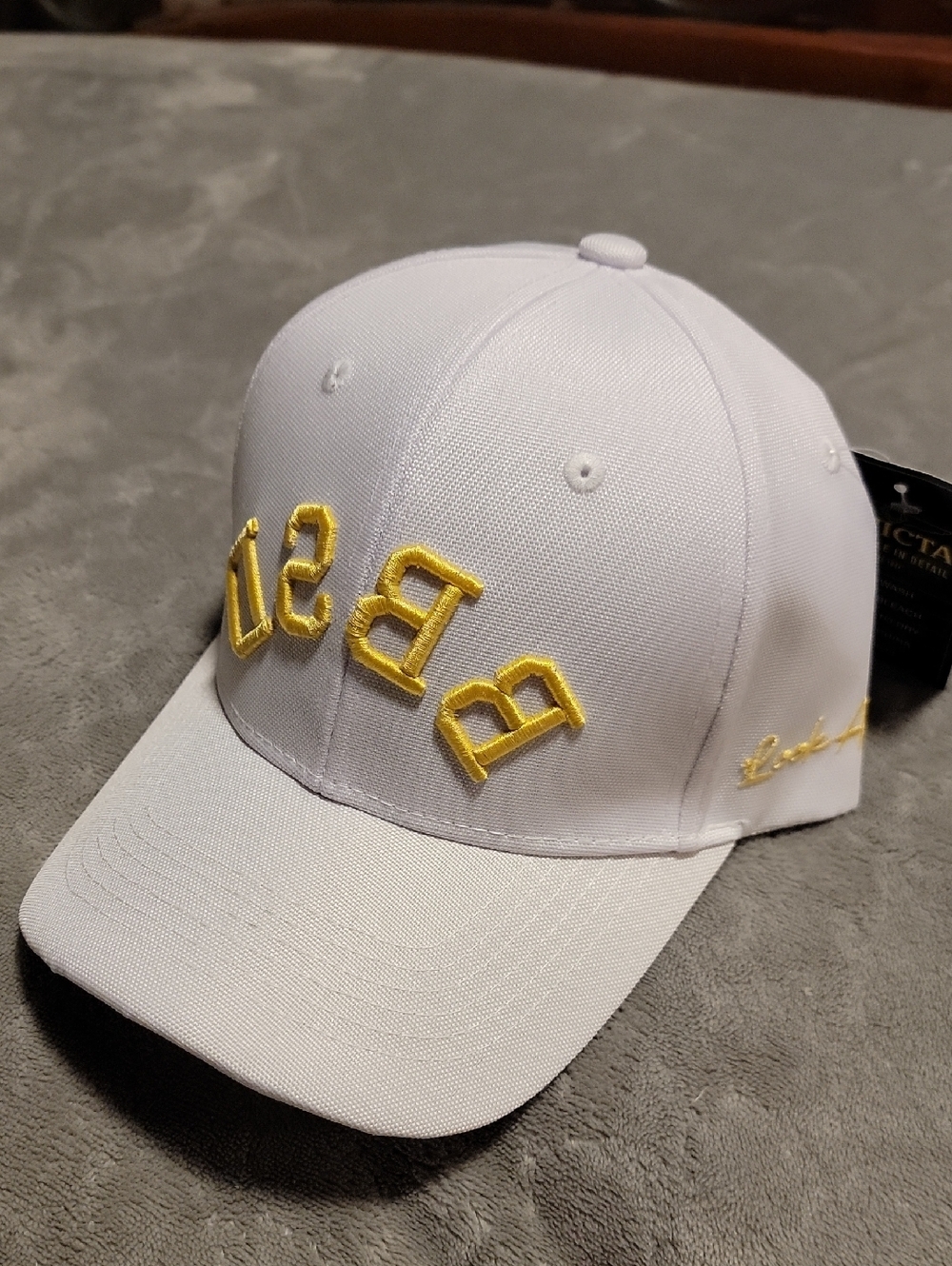 White Invicta BBSD Baseball Cap with Embroidered Yellow Lettering "Look Alive"